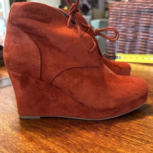 Report burnt orange wedge booties. Size 7 EUC.